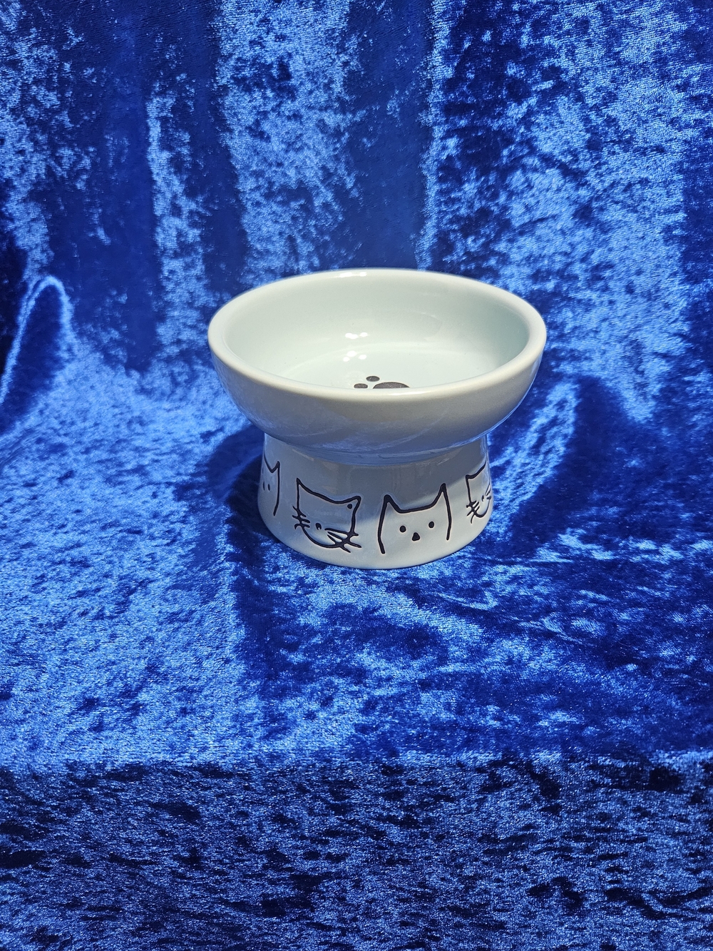 Elevated Ceramic Cat Food Bowl in Light Blue with Cat Face Design